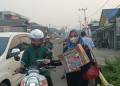 Kabut Asap Kembali Melanda, Relawan Ganjar Bersama Kalteng Barito Selatan Bagikan Masker